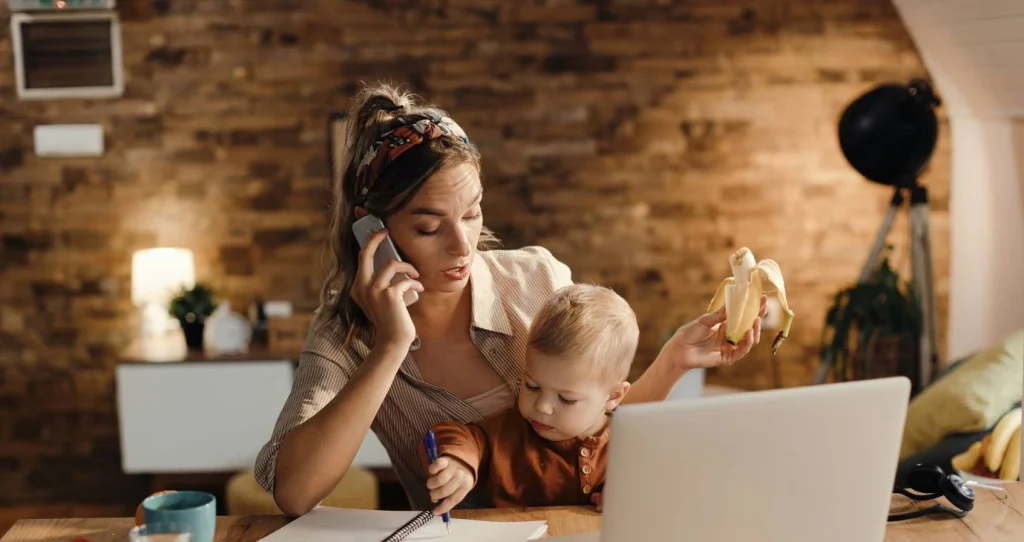 Busy mom on computer and phone
