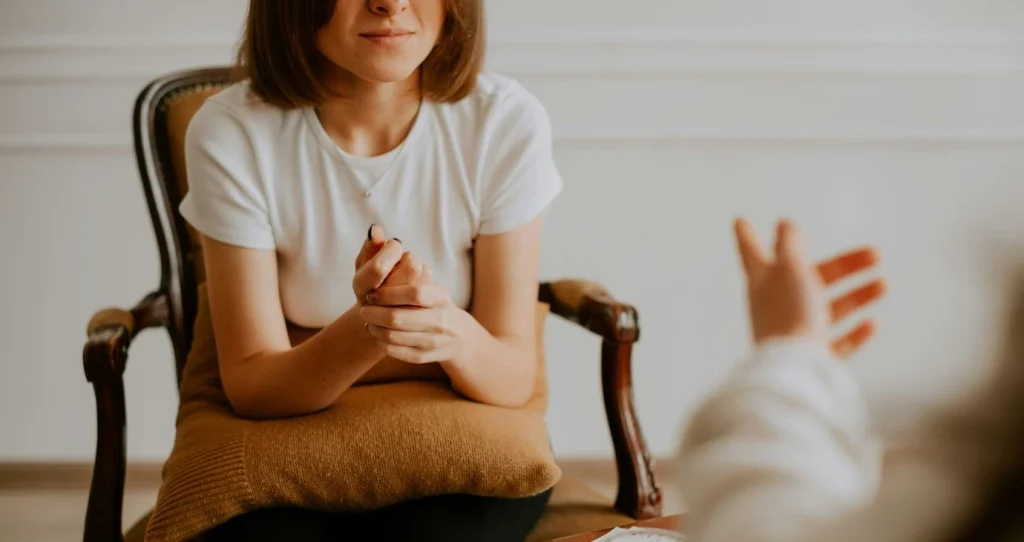 Woman in chair receiving treatment for postpartum depression